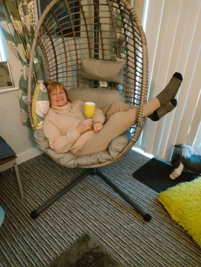 Misty posing in her new swinging egg chair
